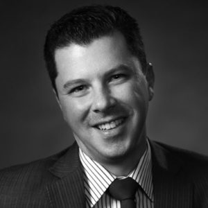 black and white headshot of jason hones who is the managing partner at land acquisition lawyers