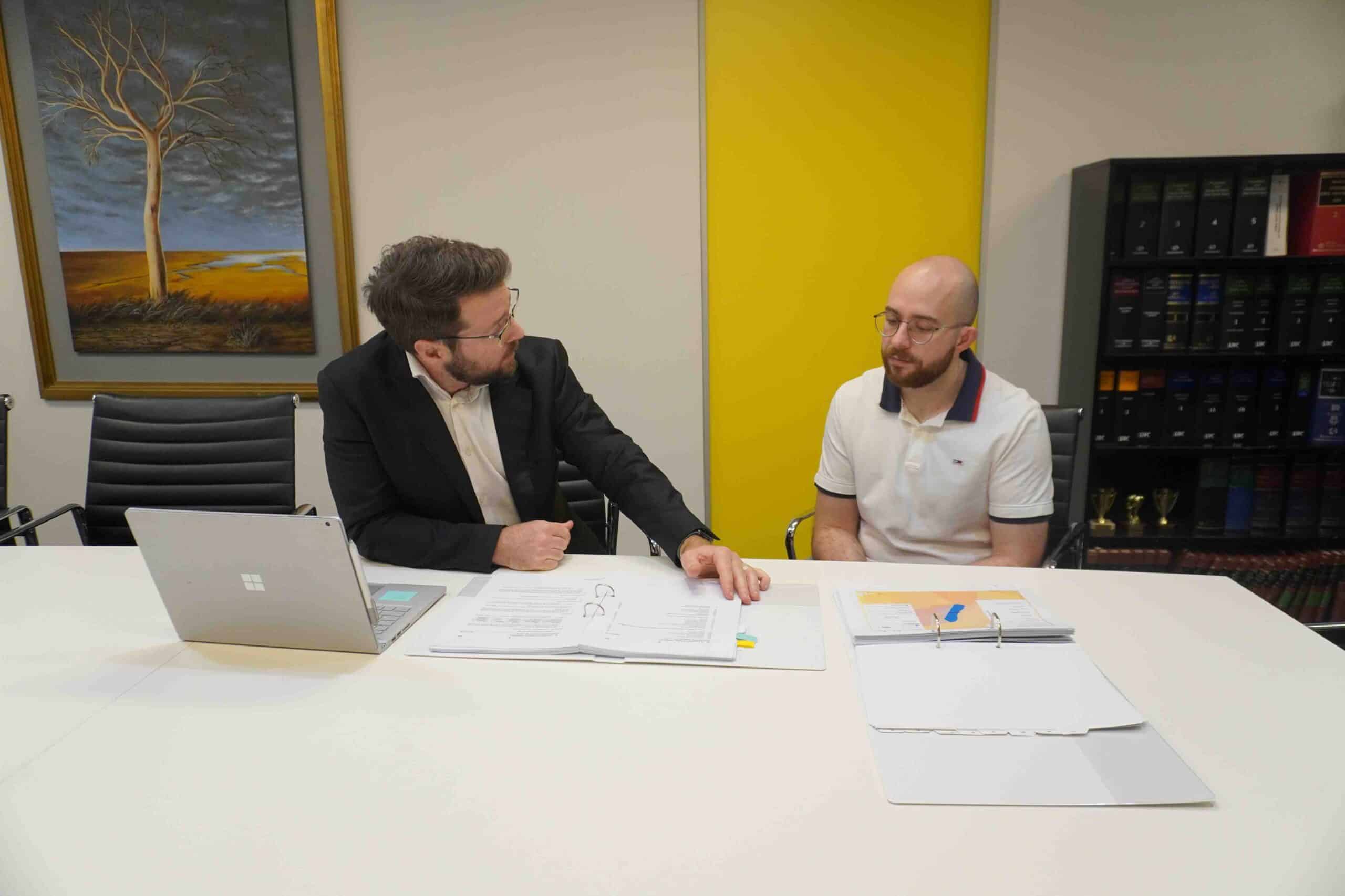 Meeting Lawyer discussing with a client in an office.