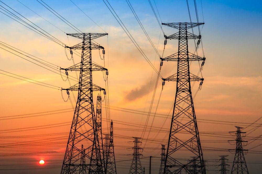 Electricity Tower Silhouette And Sky Landscape At Dusk